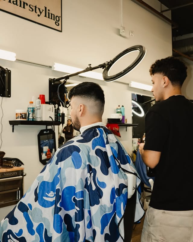 Barber Cutting Hair.